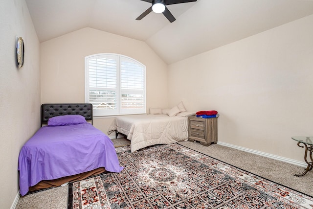 carpeted bedroom featuring lofted ceiling and ceiling fan