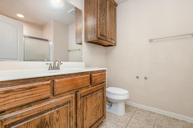 bathroom featuring tile patterned flooring, vanity, an enclosed shower, and toilet