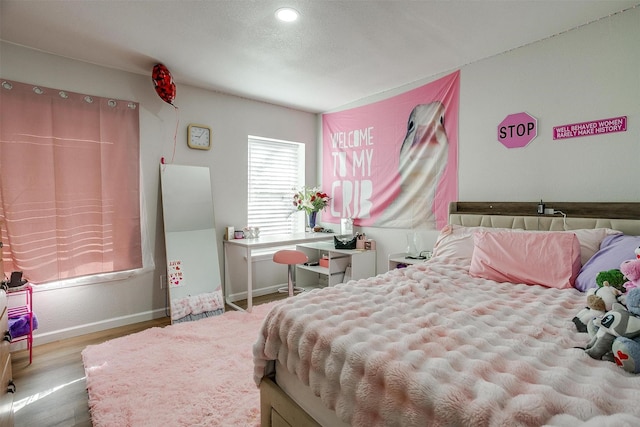 bedroom with light hardwood / wood-style flooring