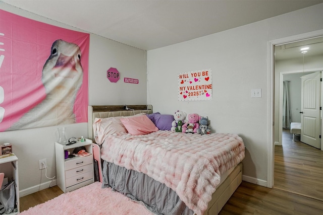 bedroom featuring dark wood-type flooring