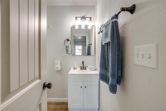 bathroom featuring vanity and wood-type flooring