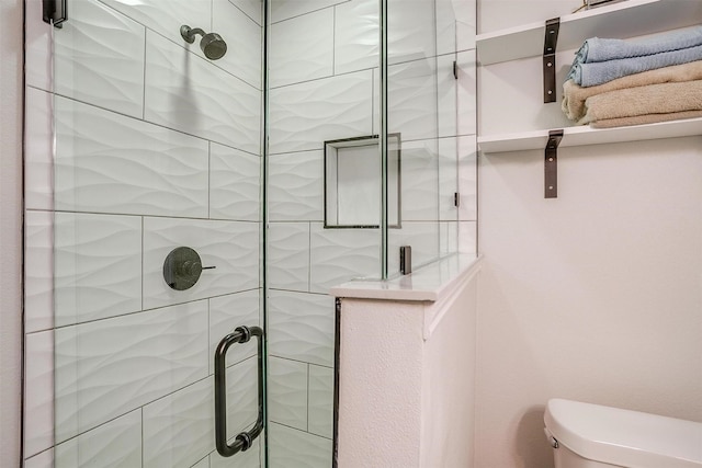 bathroom featuring walk in shower and toilet