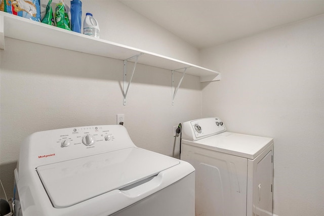 laundry room with separate washer and dryer