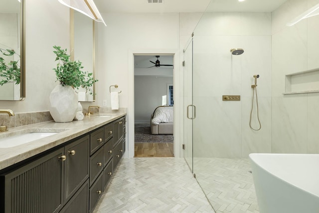 bathroom with vanity, hardwood / wood-style flooring, and plus walk in shower