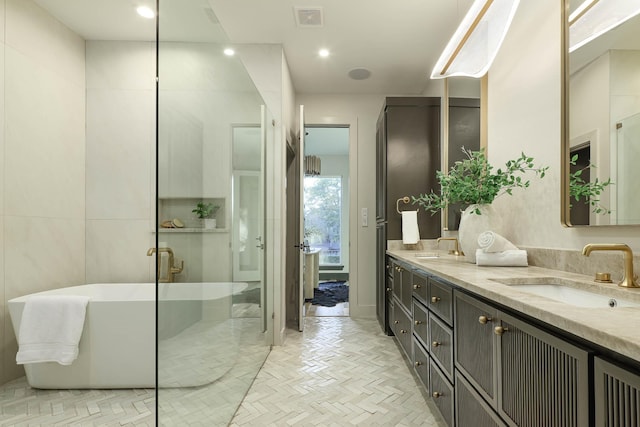 bathroom featuring vanity and plus walk in shower