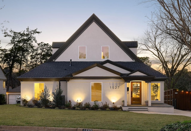 view of front of home with a lawn