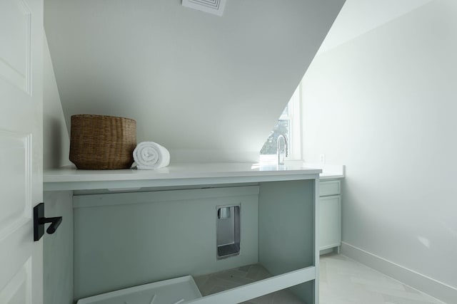 interior space with vaulted ceiling and sink