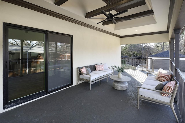 view of patio with ceiling fan and a balcony