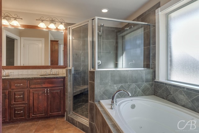 bathroom featuring vanity, tile patterned flooring, and plus walk in shower