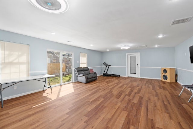 living area with hardwood / wood-style floors