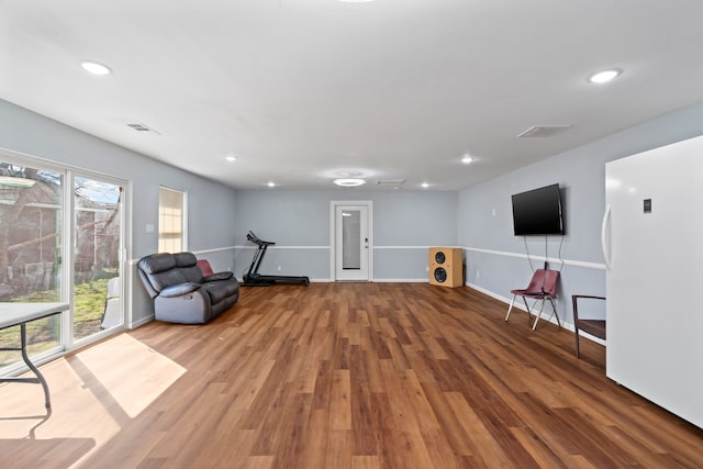 unfurnished room featuring hardwood / wood-style flooring