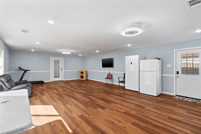 unfurnished living room with wood-type flooring