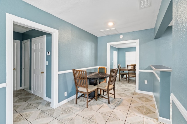 dining area featuring light tile patterned floors