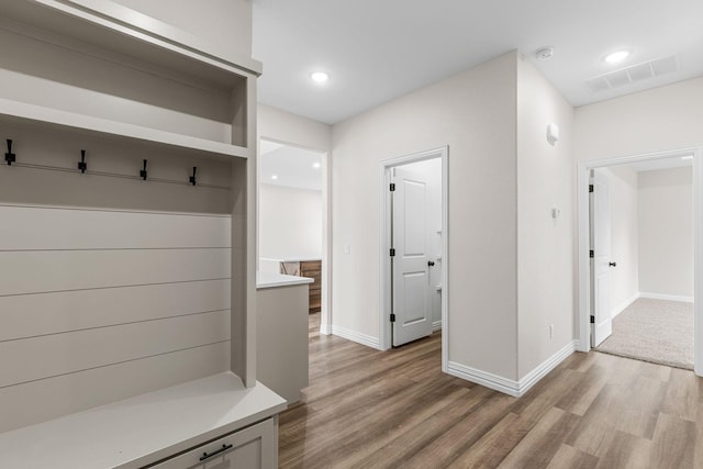 mudroom with light hardwood / wood-style flooring