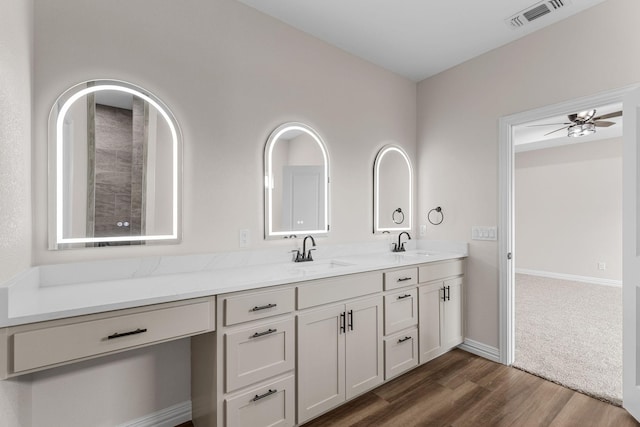 bathroom featuring vanity, hardwood / wood-style floors, and ceiling fan