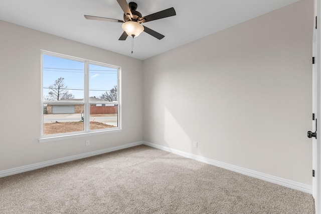 unfurnished room with ceiling fan and carpet floors