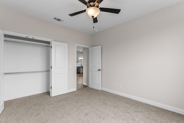 unfurnished bedroom featuring a closet, ceiling fan, and carpet flooring