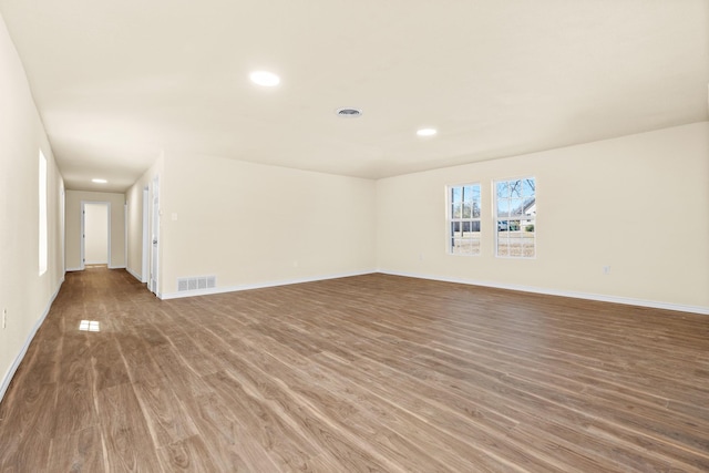 spare room featuring hardwood / wood-style flooring