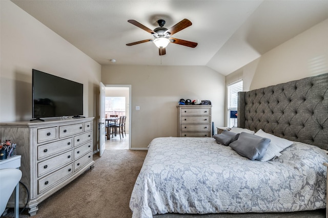 bedroom with lofted ceiling, dark carpet, and ceiling fan