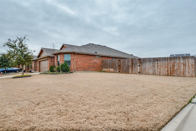 view of side of home with a garage