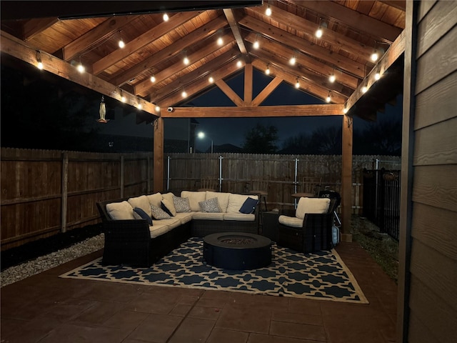 view of patio / terrace featuring an outdoor living space with a fire pit