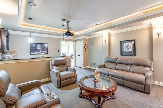 living room featuring a tray ceiling, ornamental molding, and light colored carpet