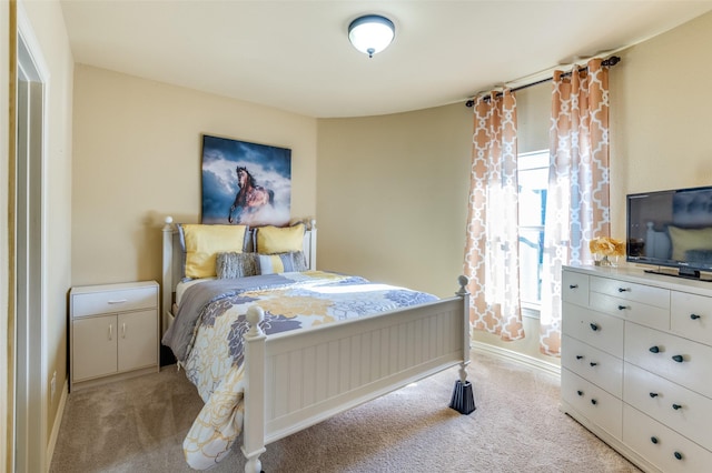 bedroom with light carpet