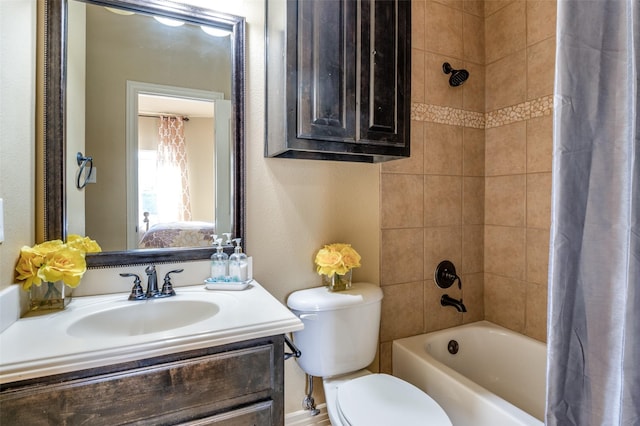 full bathroom featuring toilet, vanity, and shower / bath combo with shower curtain