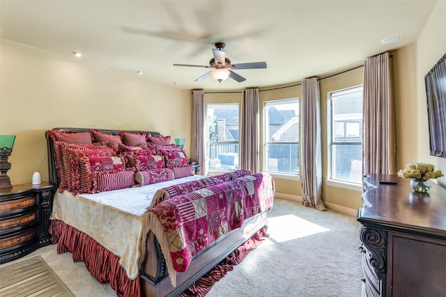 carpeted bedroom featuring ceiling fan