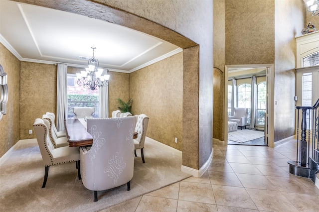 tiled dining space with an inviting chandelier and crown molding