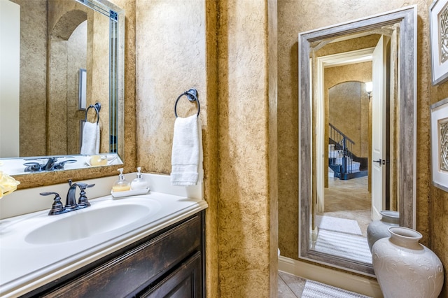 bathroom featuring tile patterned flooring and vanity