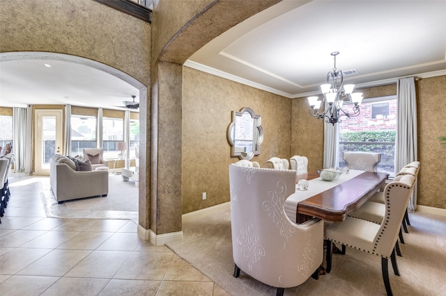 dining space featuring ceiling fan with notable chandelier, ornamental molding, and light tile patterned flooring