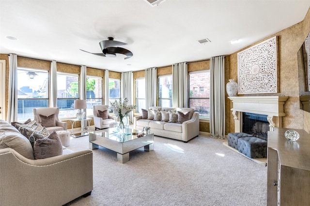 living room featuring ceiling fan and light colored carpet