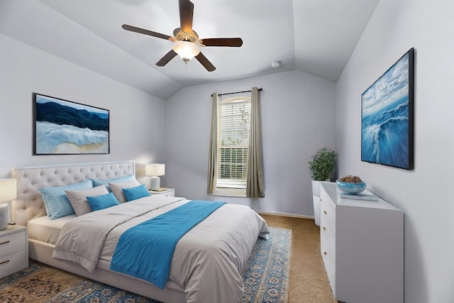 carpeted bedroom featuring a ceiling fan and vaulted ceiling