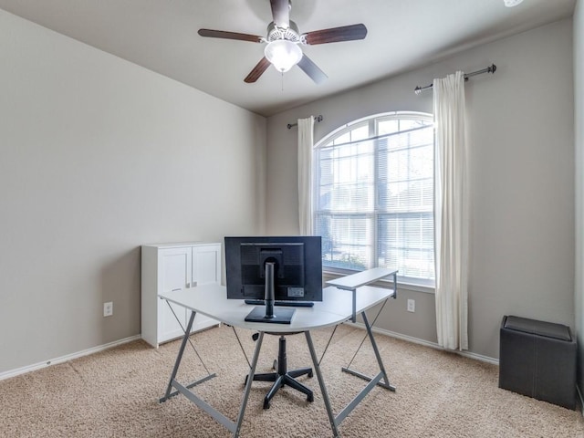 office space featuring light colored carpet and ceiling fan