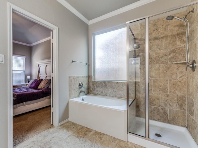 bathroom with ornamental molding and independent shower and bath