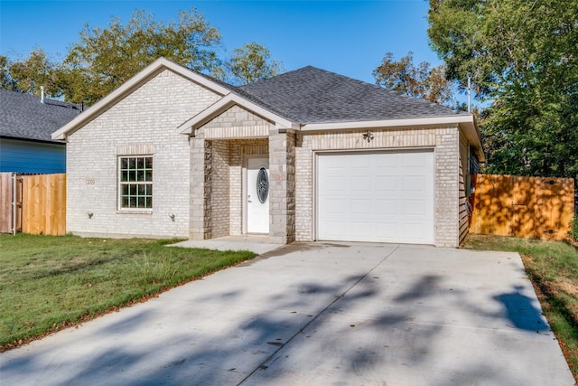 view of front of home featuring a garage and a front yard