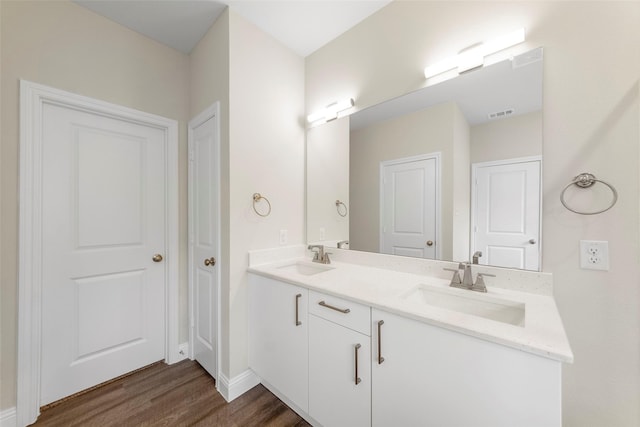 bathroom featuring vanity and wood-type flooring