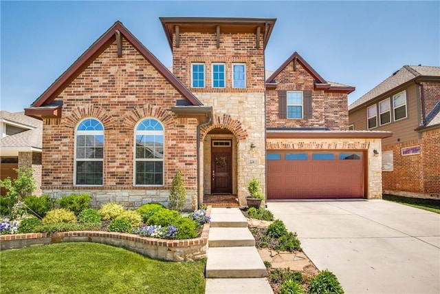 view of front of property with a garage