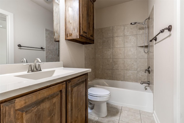 full bathroom with tile patterned flooring, vanity, toilet, and tiled shower / bath