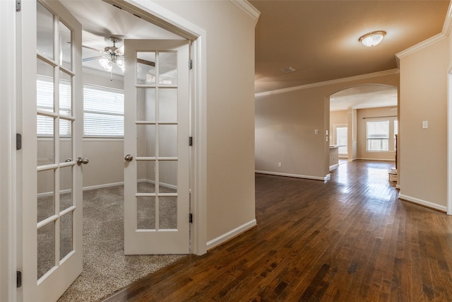 corridor featuring ornamental molding, dark hardwood / wood-style floors, and french doors