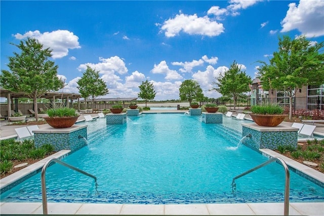 view of swimming pool featuring pool water feature