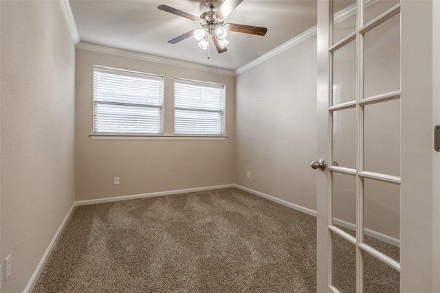 carpeted empty room featuring crown molding and ceiling fan