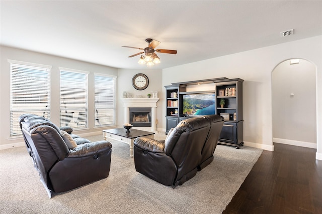 living room with hardwood / wood-style floors and ceiling fan