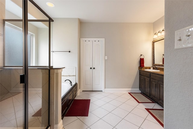 bathroom featuring vanity, tile patterned floors, and shower with separate bathtub