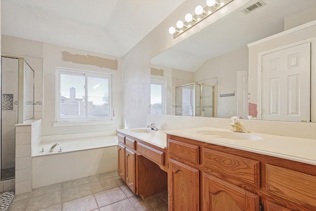 bathroom featuring lofted ceiling, vanity, and separate shower and tub