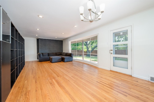 unfurnished room featuring recessed lighting, visible vents, a notable chandelier, and wood finished floors