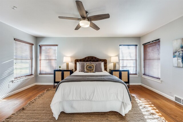 corridor featuring dark tile patterned floors, recessed lighting, and baseboards