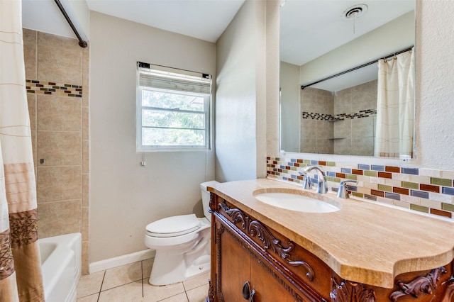 bathroom with tile patterned flooring, toilet, visible vents, vanity, and backsplash