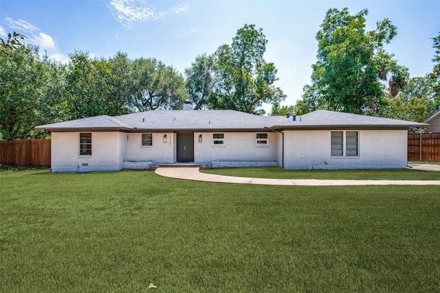 back of house featuring a lawn